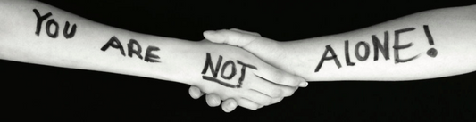 two people holding hands for suicide awareness